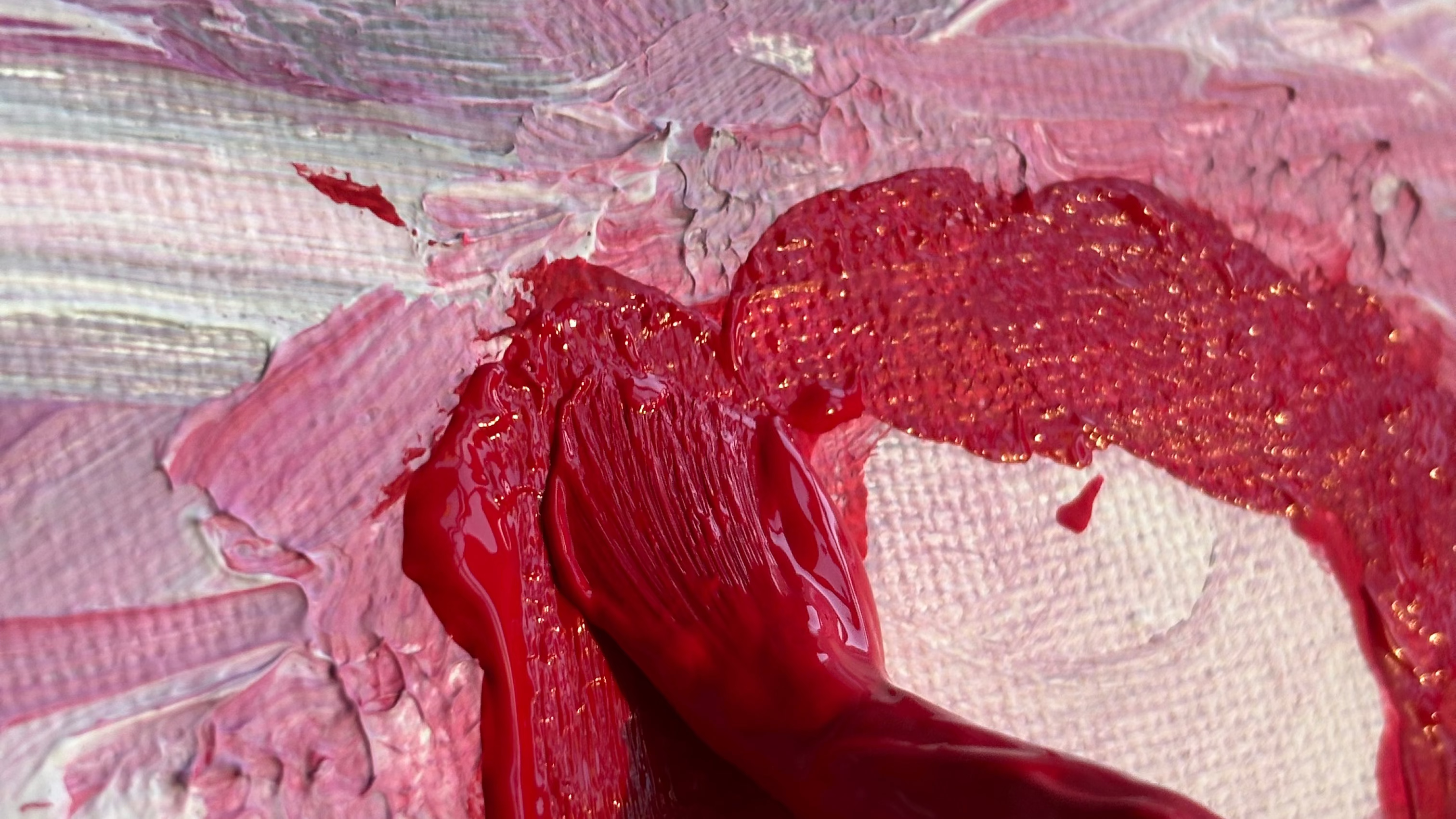 Close-up of pink and red abstract paint textures